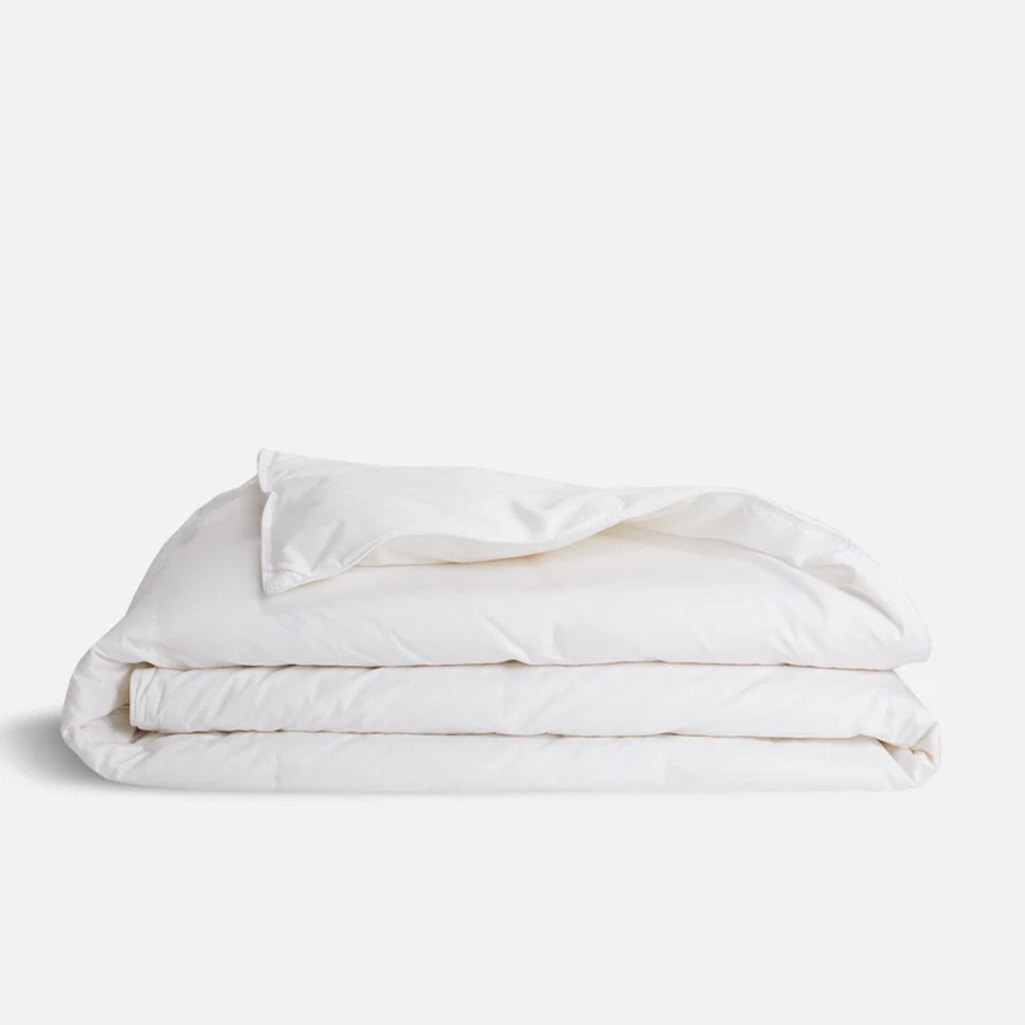 A white folded Brooklinen down alternative duvet