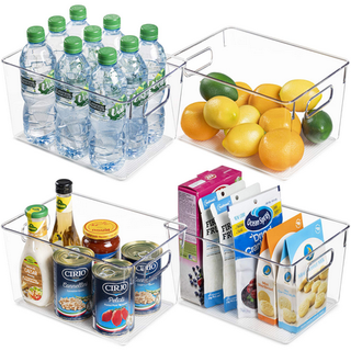 Four clear plastic storage bins with handle cut outs. Filled with various food items, such as water bottles, fresh fruit. tins and jars, and food packets. 