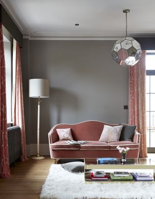 grey living room with pink curtains