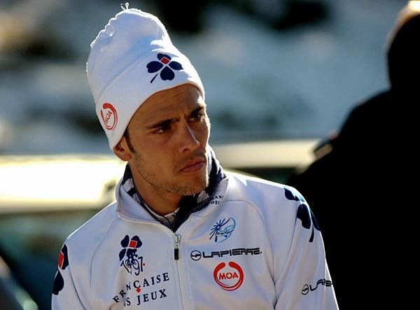 R&eacute;my Di Gregorio (Fran&ccedil;aise des Jeux) tries to stay warm after the finish.
