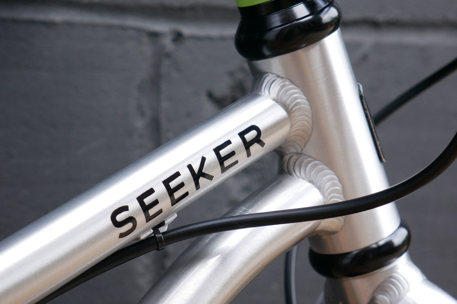 a close in shot of the Early Rider Seeker 16 headtube weld and Seeker top tube logo