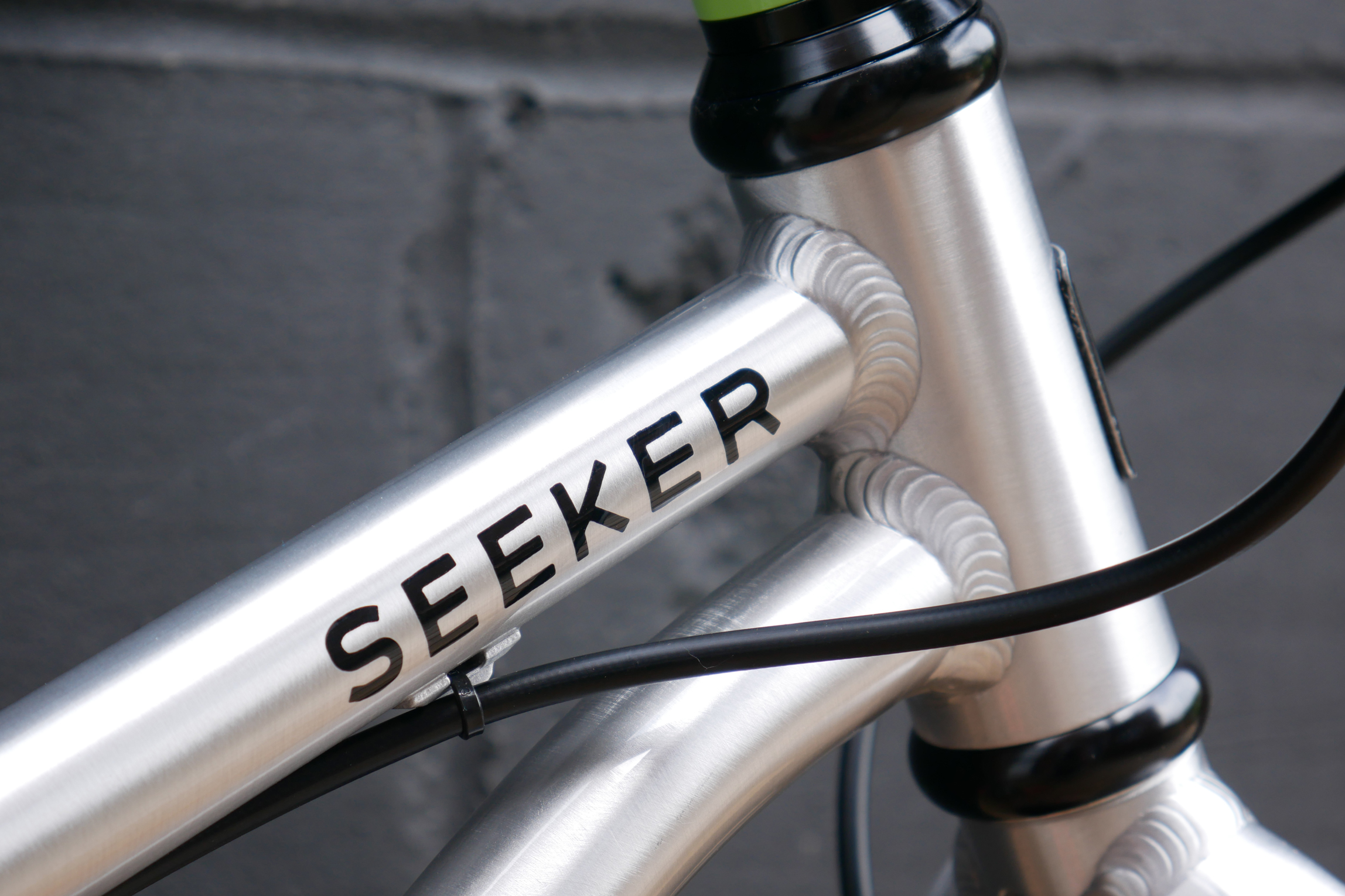 a close in shot of the Early Rider Seeker 16 headtube weld and Seeker top tube logo