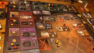 The Dune: Imperium - Bloodlines board mid-game, with tokens, tiles, cards, and miniatures laid out across it