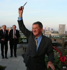 Hugh Johnson prepares to cut the ribbon