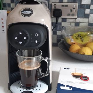 Lavazza Idola coffee machine with cup of coffee
