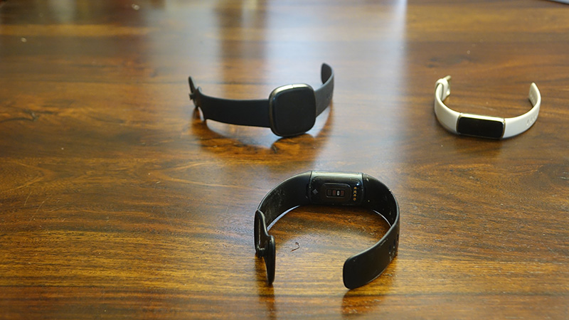 Three Fitbits on a table