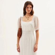 Woman wears white dress