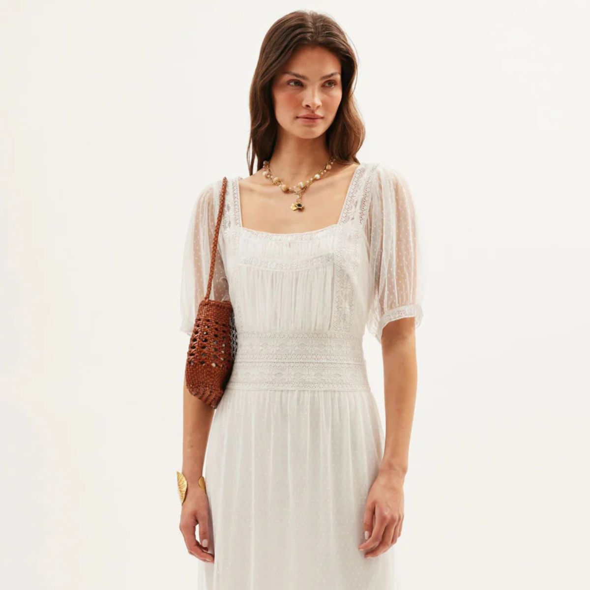 Woman wears white dress