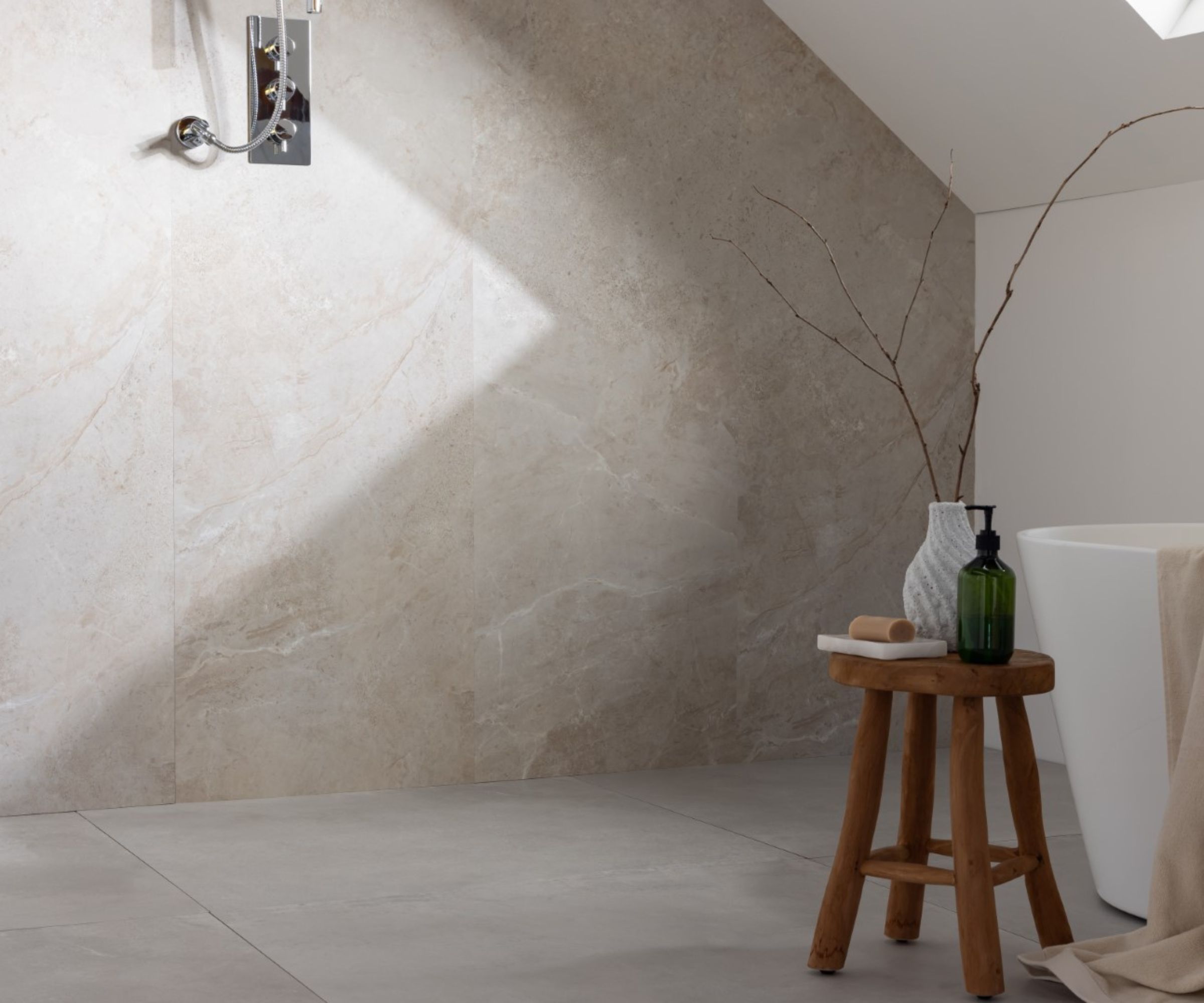 A wet room with natural stone effect wet wall panels and a small wooden stool with vases placed on top