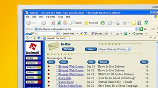 A monitor on a yellow background showing Hotmail in 1997