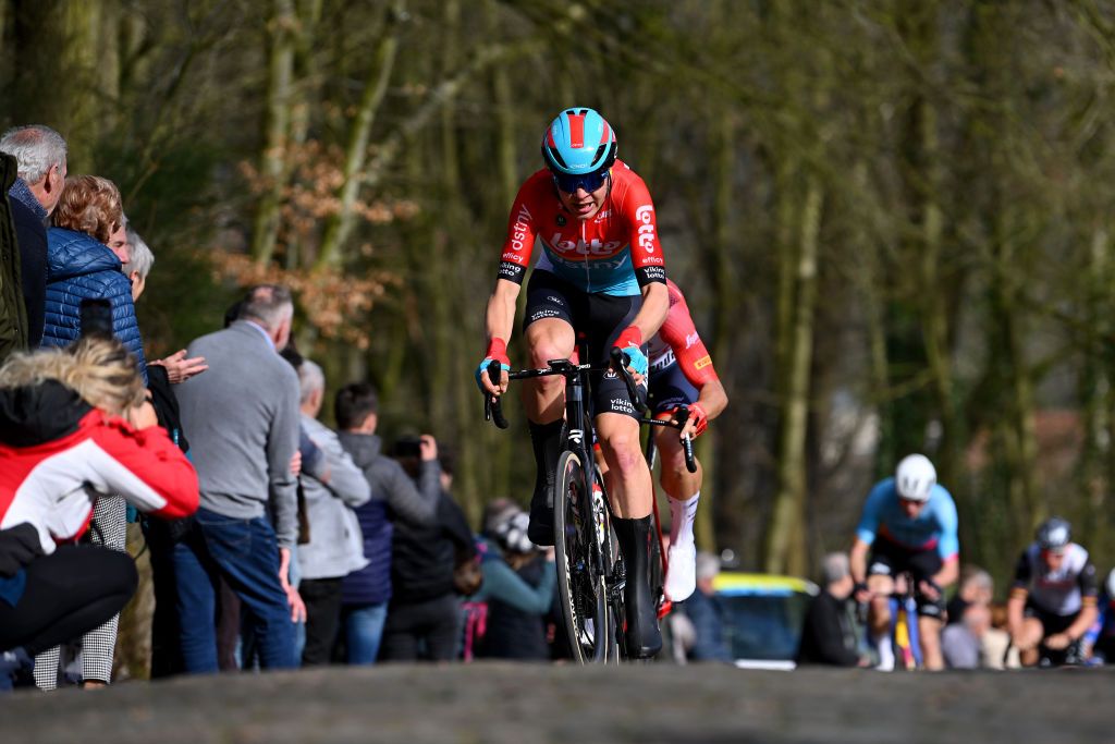 BREDENE BELGIUM MARCH 17 Florian Vermeersch of Belgium and Team Lotto Dstny competes passing through a Kemmelberg cobblestones sector during the 21th Bredene Koksijde Classic 2023 a 1916km one day race from Bredene to Koksijde on March 17 2023 in Koksijde Belgium Photo by Luc ClaessenGetty Images