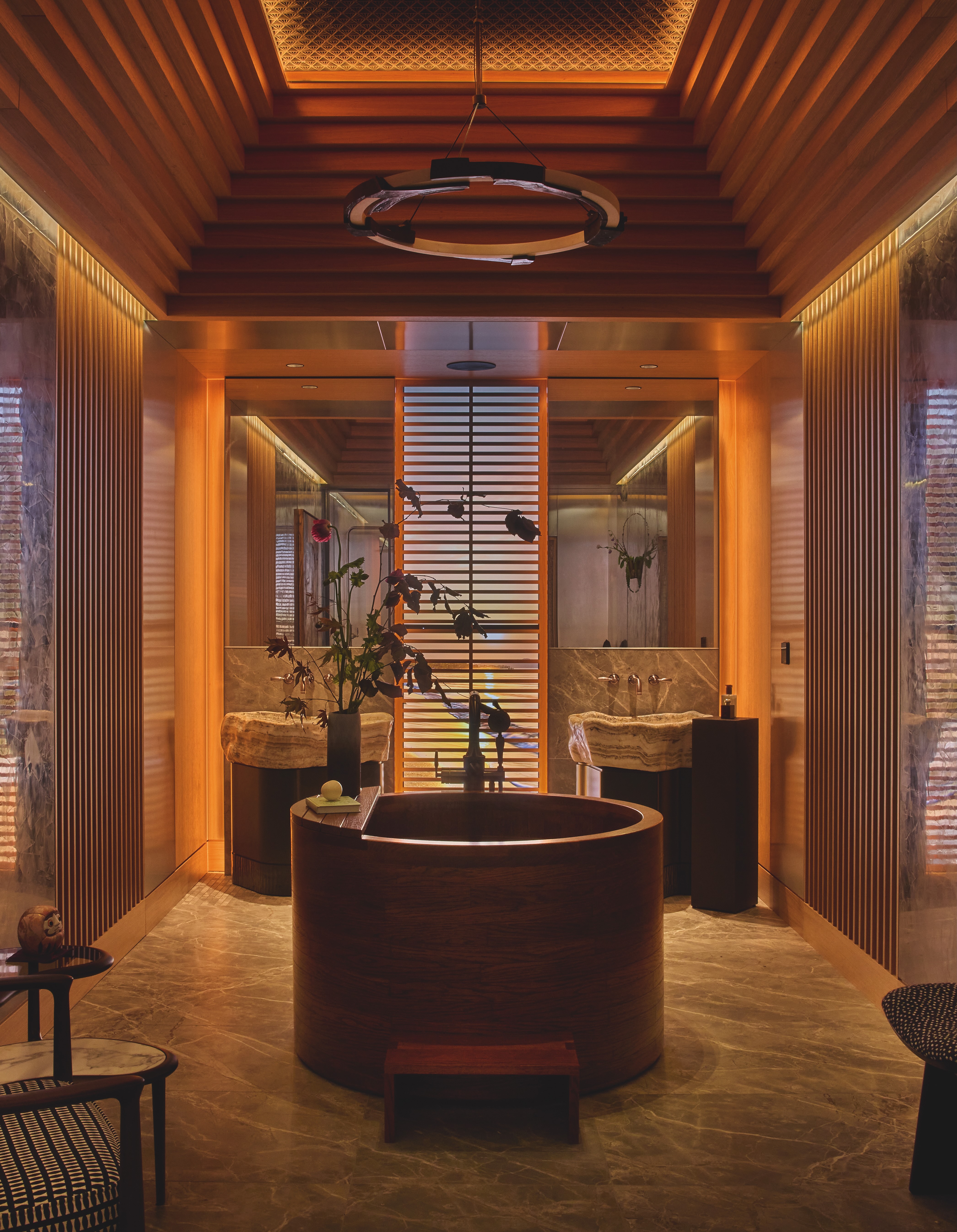Another bathroom with a circular bath in the middle