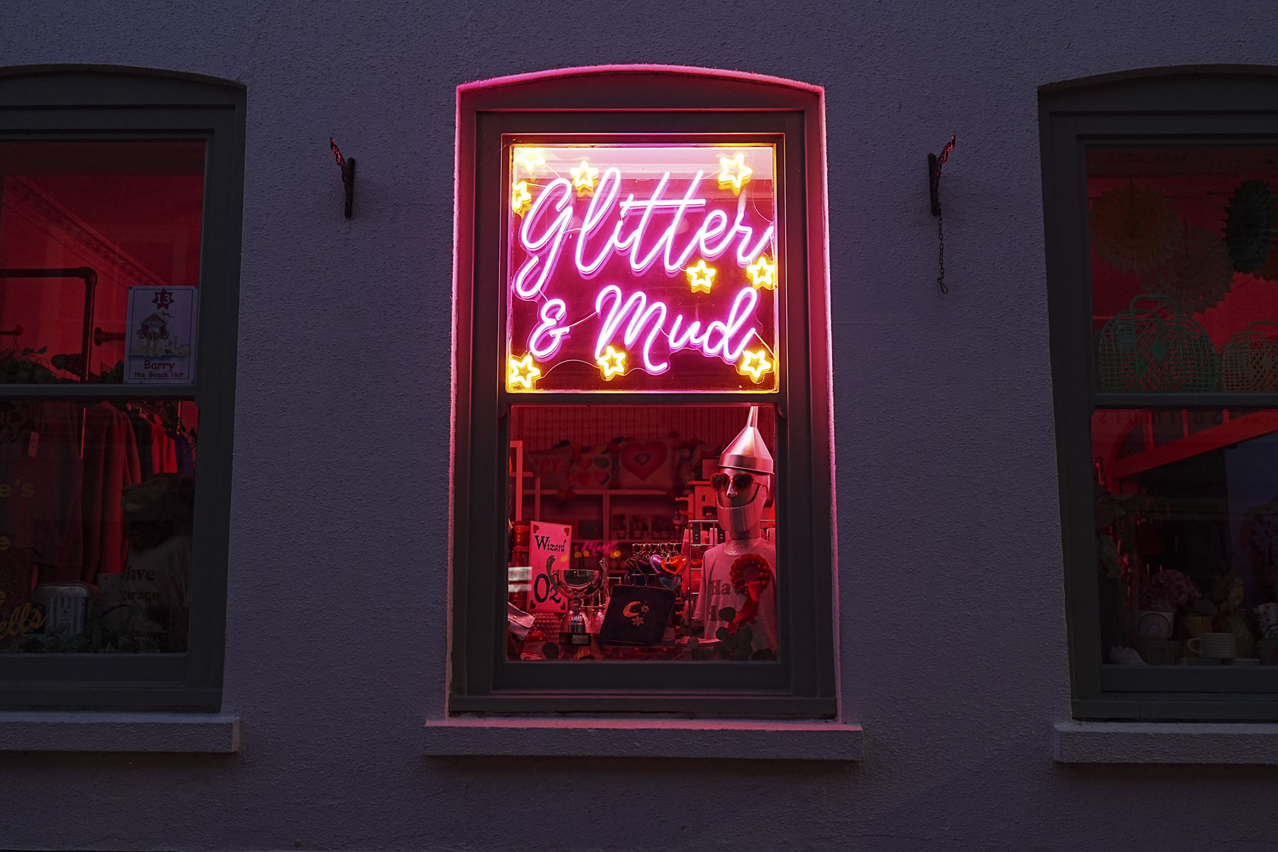 Neon lights in shop window at night, captured with the Sony A7C II full-frame mirrorless camera