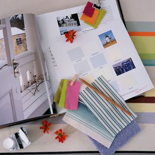 magazine book with white wooden door and pencil