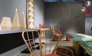 From left: containers by Nada Debs; 'Baz' rugs by Taher Asad-Bakhtiari; 'Series 3' by Karen Chekerdjian; 'Petal' chairs by Wyssem Nochi; 'Landscape' table by India Mahdavi; and 'Bubble' series lighting by Lindsey Adelman, at the Carwan Gallery stand.