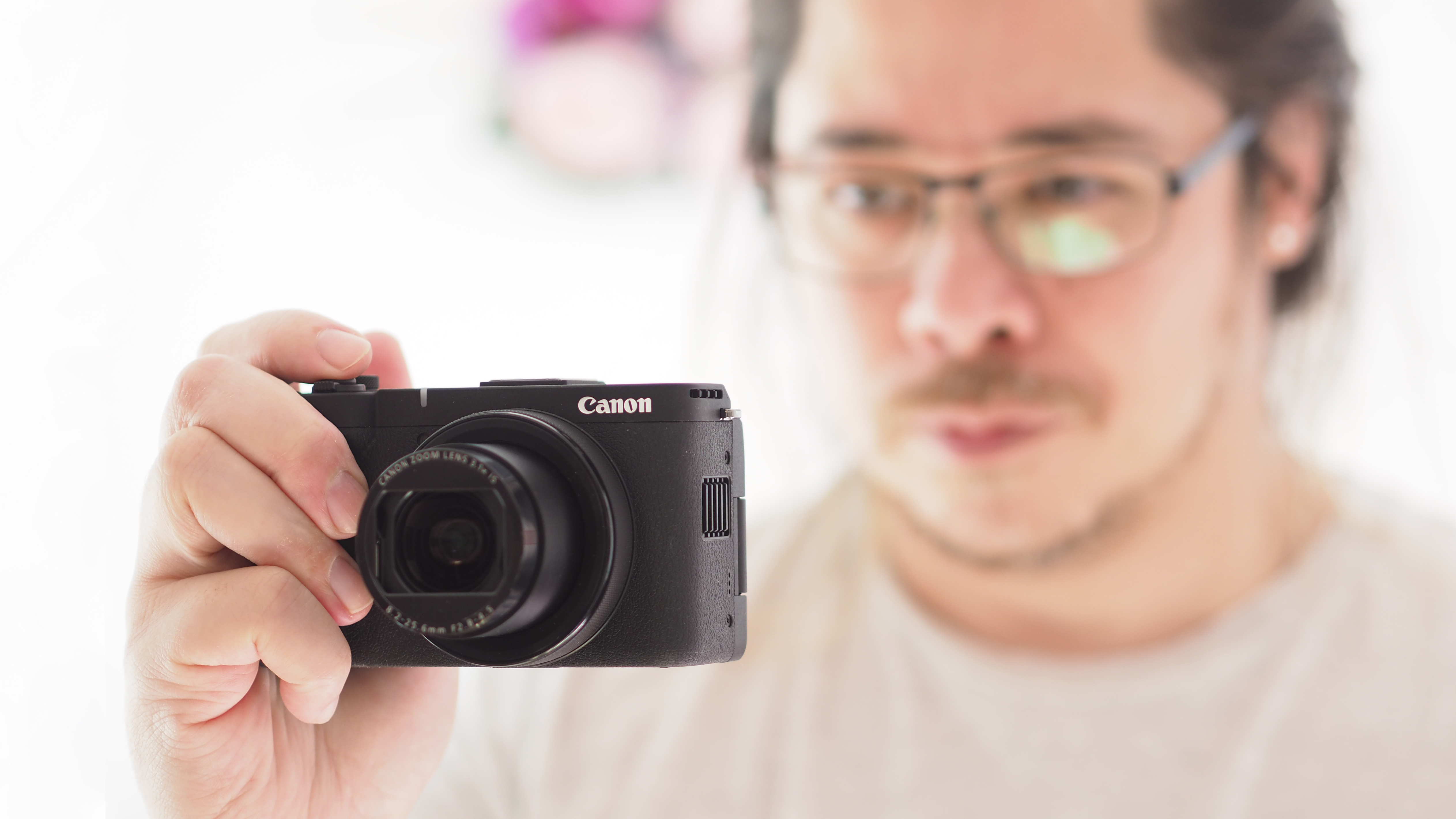 Reviewer James Artaius holding the Canon PowerShot V1