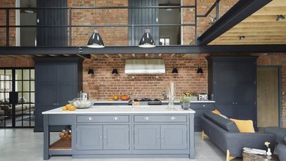 kitchen with counter and brick wall