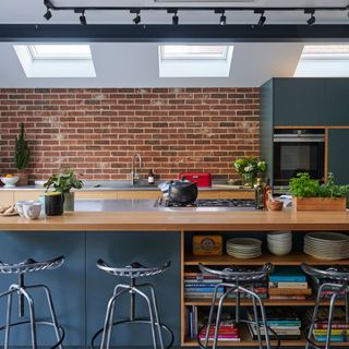 kitchen with brick wall wooden counter and roof window