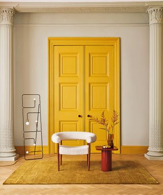 Yellow double doors with traditional architraves