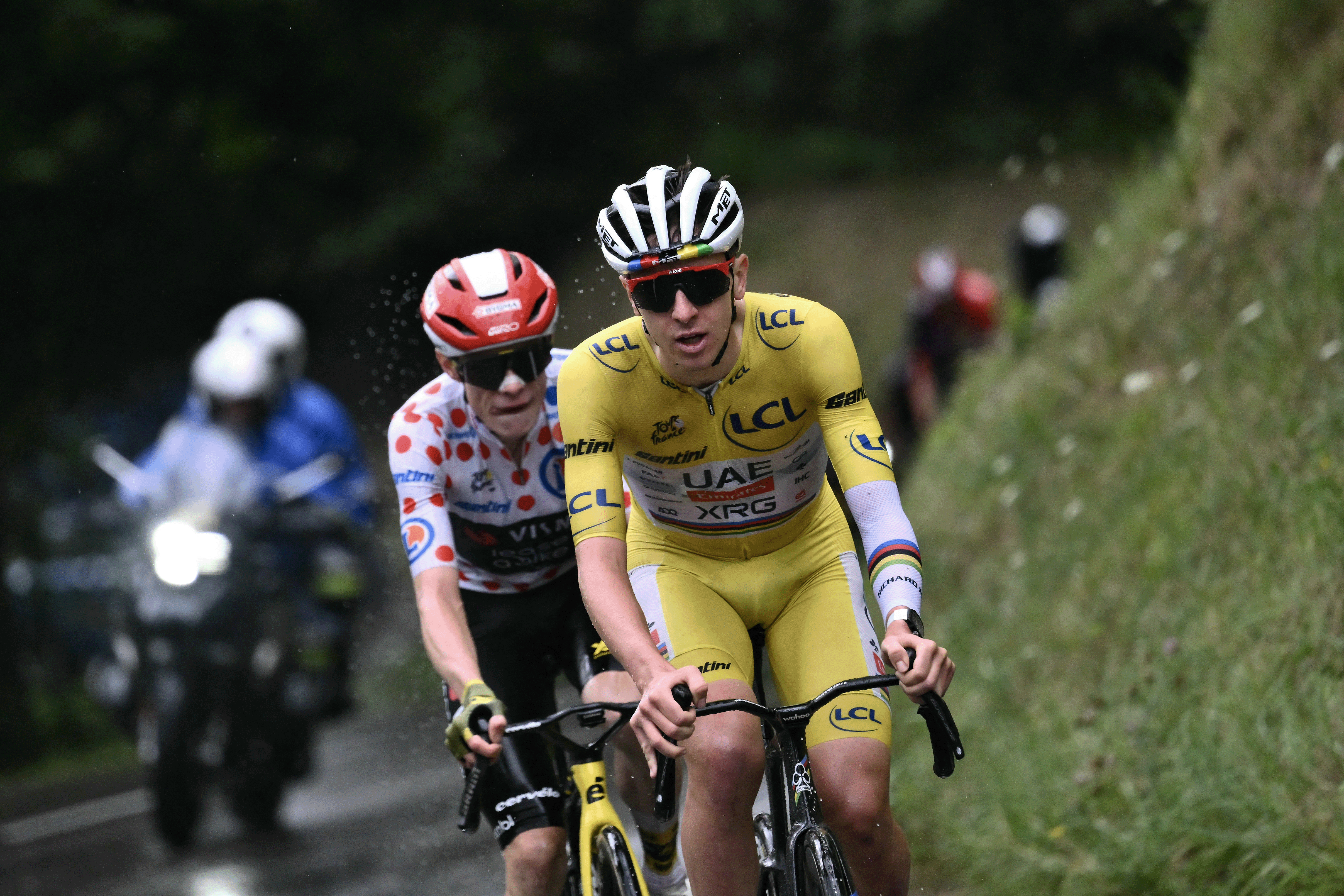 UAE Team Emirates - XRG team&#039;s Slovenian rider Tadej Pogacar wearing the overall leader&#039;s yellow jersey and Team Visma - Lease a bike team&#039;s Danish rider Jonas Vingegaard wearing the best climber&#039;s polka dot (dotted) jersey cycle in the final ascent of La Plagne during the 19th stage of the 112th edition of the Tour de France cycling race, 93.1 km between Albertville and La Plagne, in the French Alps, on July 25, 2025. The 19th stage of the Tour de France was shorted from its initial 129.9 km route, bypassing the Col des Saisies where an outbreak of nodular dermatitis in a herd of cattle was discovered, prompting organizers to modify the race route. (Photo by Marco BERTORELLO / AFP) (Photo by MARCO BERTORELLO/AFP via Getty Images)