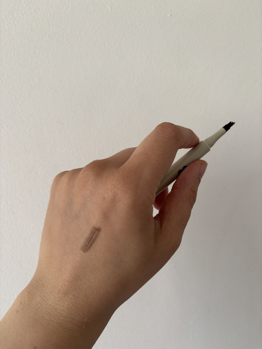 Mica Ricketts showing swatch of blink brow pen