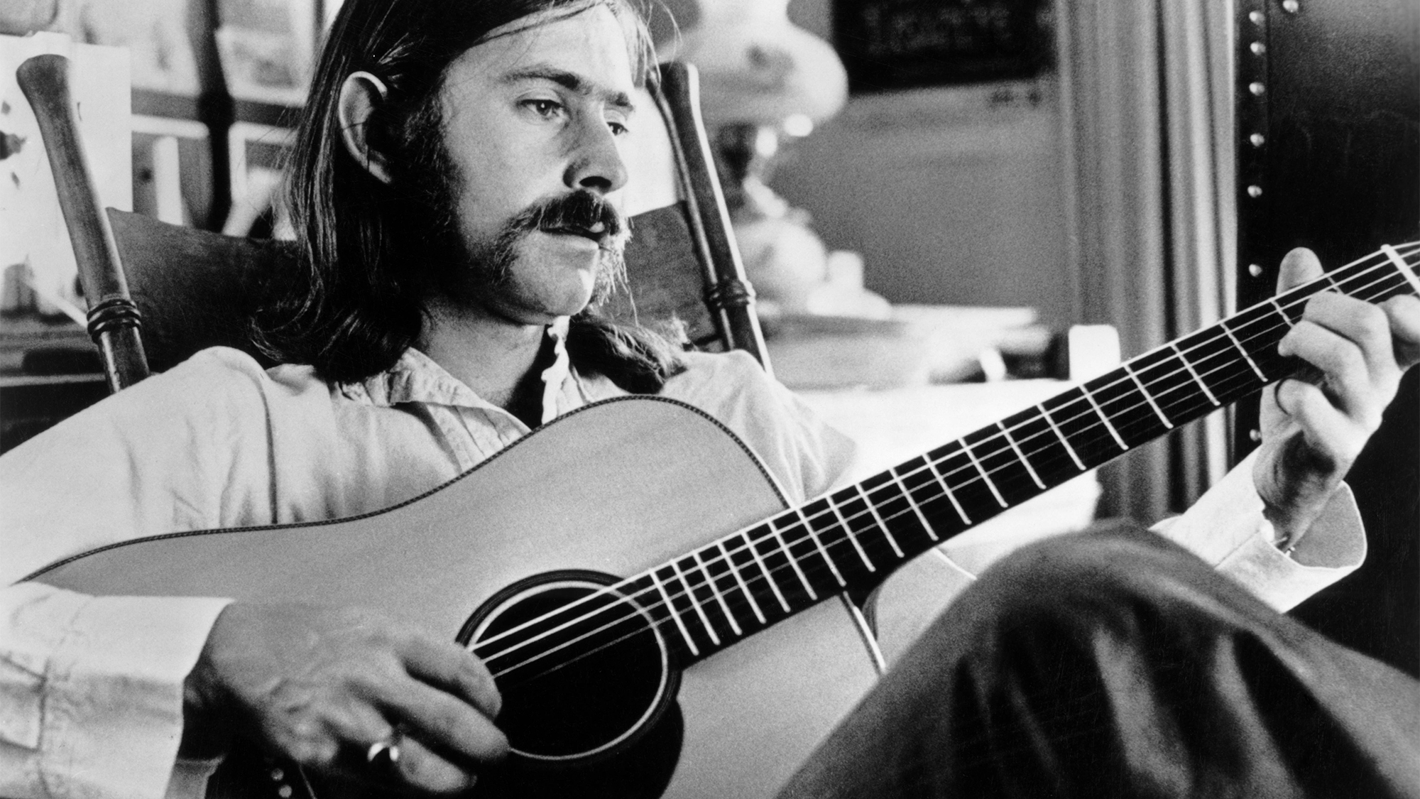 Norman Greenbaum poses with acoustic guitar circa 1969