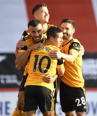 Saiss (left) helped Wolves get their season off to a winning start with a goal against Sheffield United