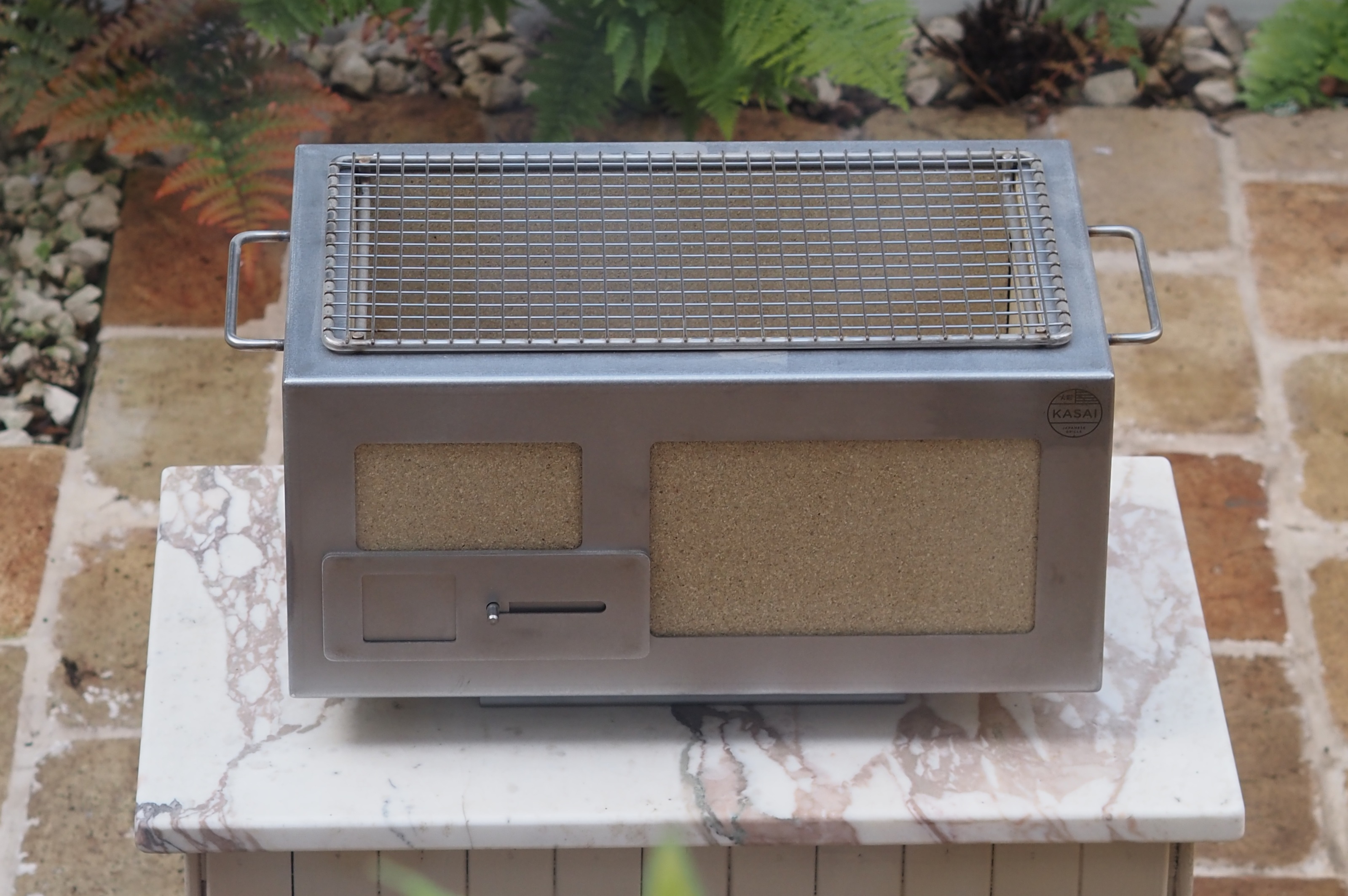 a kasai bbq grill in a garden 