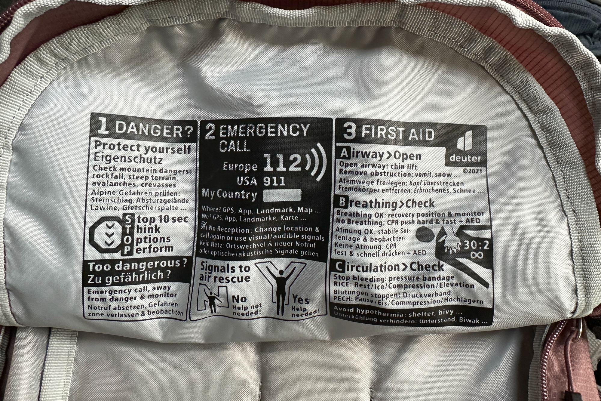 close up of the emergency information printed on the inside of a Deuter backpack