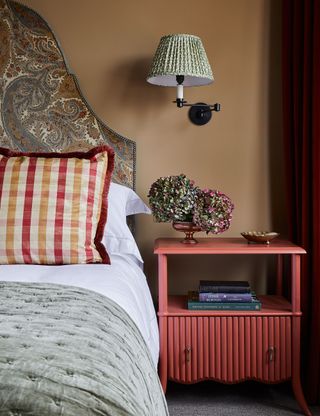 Color of the month caramel bedroom with red side table