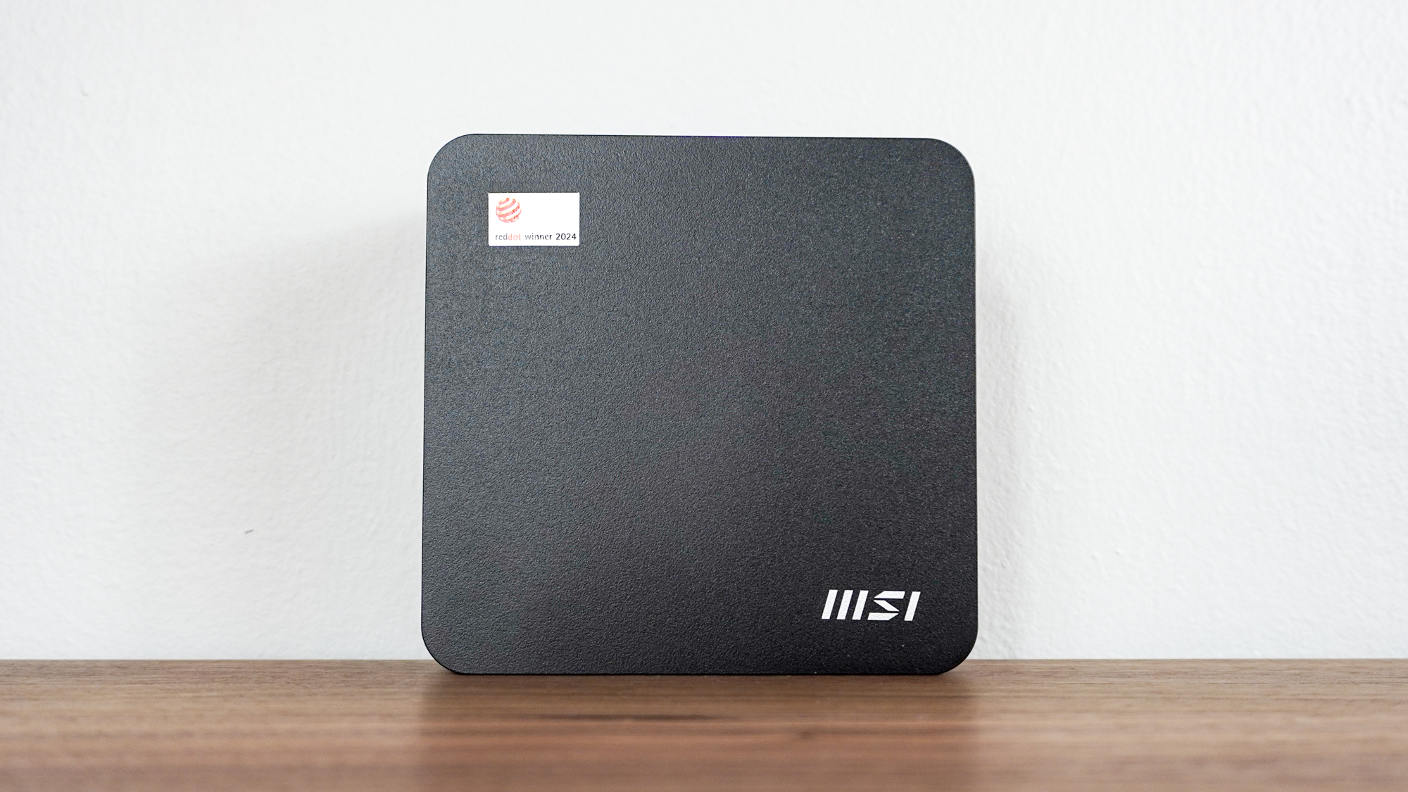 The MSI Cubi NUC AI+ 2MG upright on a desk