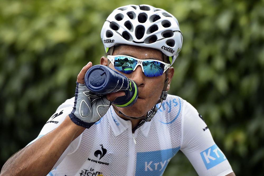 Nairo Quintana (Movistar) takes in some water on stage 18