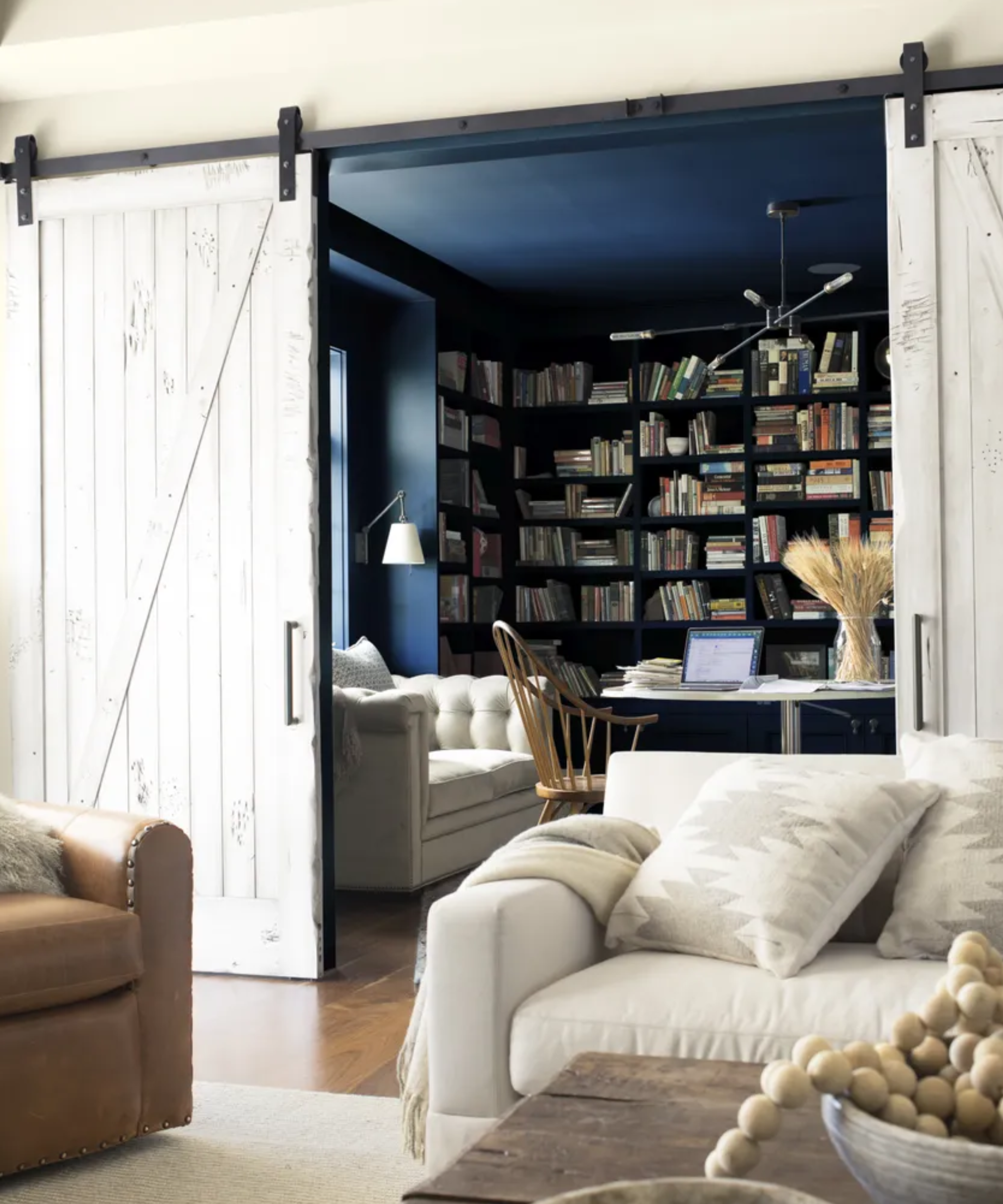 Small snug with library behind sliding wooden doors