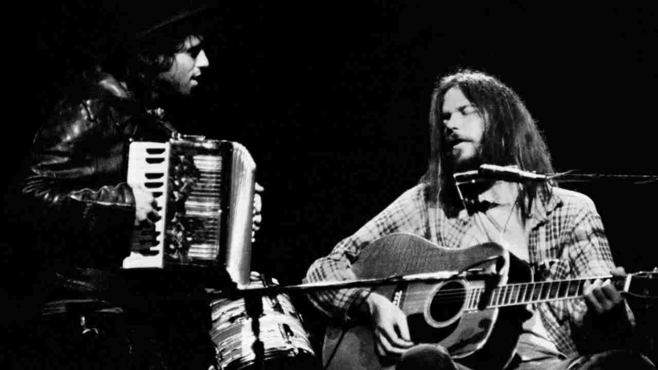 Nils Lofgren and Neil Young Nils Lofgren performing onstage in the 1970s