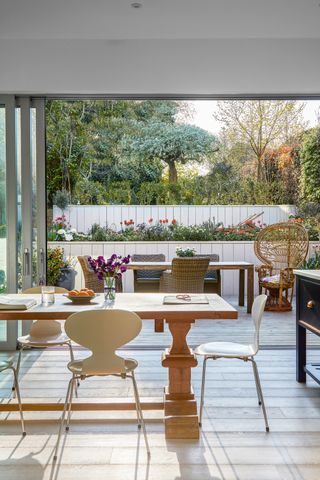 Dining room opening out onto small garden with levels