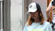 EMILY BLUNT HEADSHOT WEARING A HAT