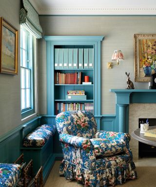 Small living room with sky blue painted woodwork and textured gray walls