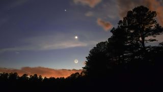 The crescent moon meets Jupiter and Venus in the sky above New Jersey.