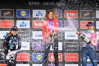 WEVELGEM BELGIUM MARCH 26 LR Megan Jastrab of The United States and Team DSM on second place race winner Marlen Reusser of Switzerland and Team SD Worx and Maike Van Der Duin of The Netherlands and Team CanyonSRAM Racing on third place pose on the podium ceremony after the 12th GentWevelgem In Flanders Fields 2023 Womens Elite a 1625km one day race from Ypres to Wevelgem UCIWWT on March 26 2023 in Wevelgem Belgium Photo by Luc ClaessenGetty Images
