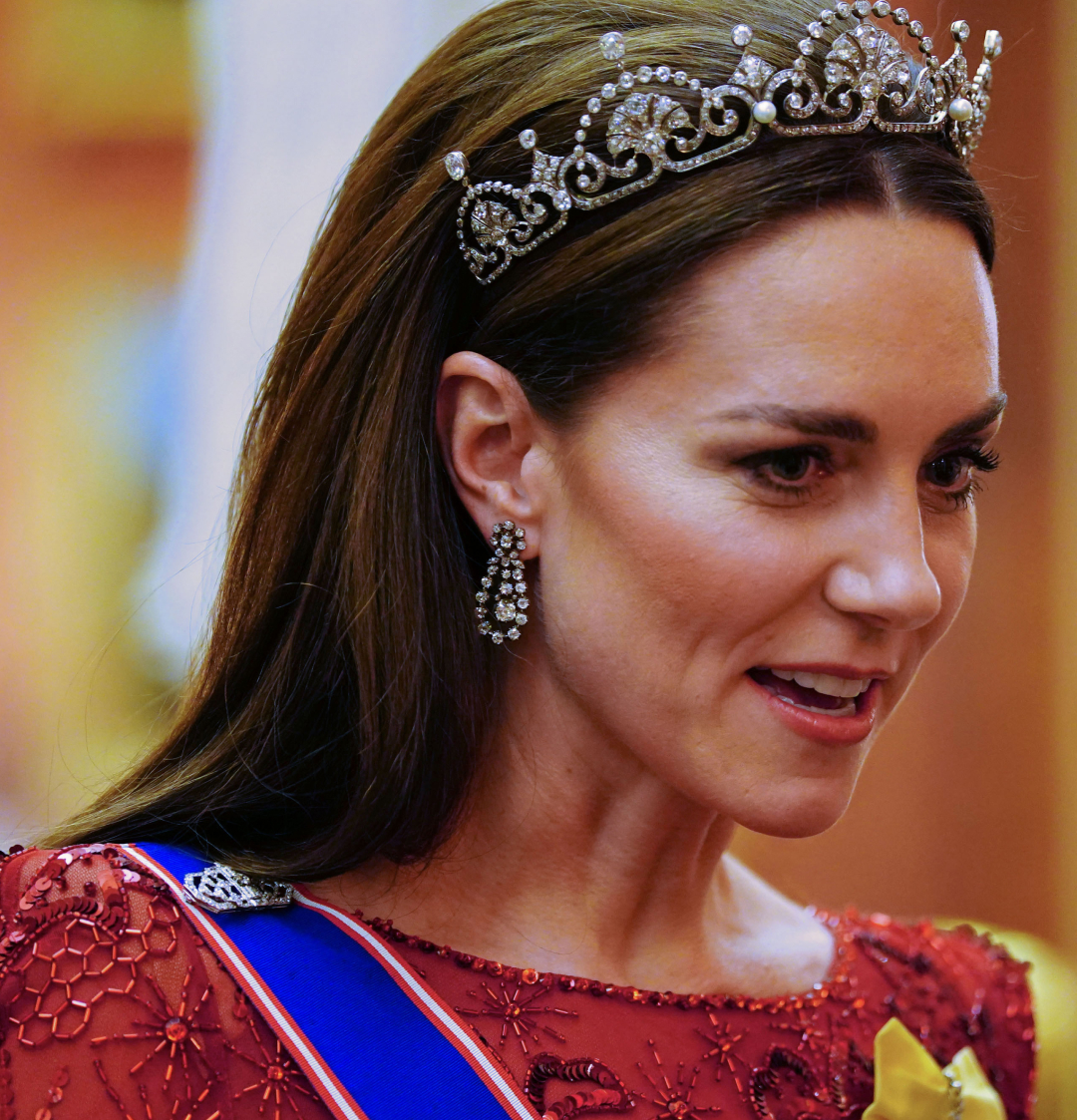 Kate Middleton wearing a tiara and a red gown