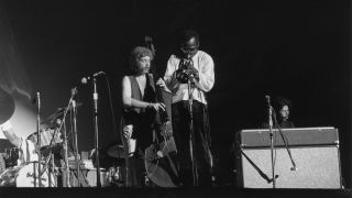 18th July 1969: Left to right: British bassist Dave Holland, American trumpeter Miles Davis (1926-1991) and American keyboardist Chick Corea perform on stage at the Longhorn Jazz Festival, Dallas Texas.