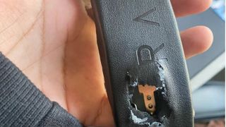Picture of Razer headset showing damage from gunshot.