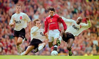 MANCHESTER, UNITED KINGDOM - OCTOBER 12: Manchester United winger Ryan Giggs is challenged by Jason McAteer (2nd l) and Michael Thomas (r) as Dominic Matteo (l) looks on during the FA Premier League match between Manchester United and Liverpool at Old Trafford on October 12, 1996 in Mnachester, Engand. (Photo by Clive Brunskill/Allsport/Getty Images)