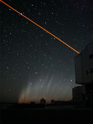 This photograph shows the tail of Comet McNaught after it had set, with the laser guide star system above Yepun (Unit Telescope 4). The laser is used to produce a fake