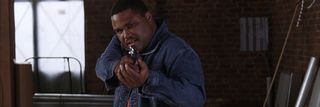 Anthony Anderson with Xs in The Departed