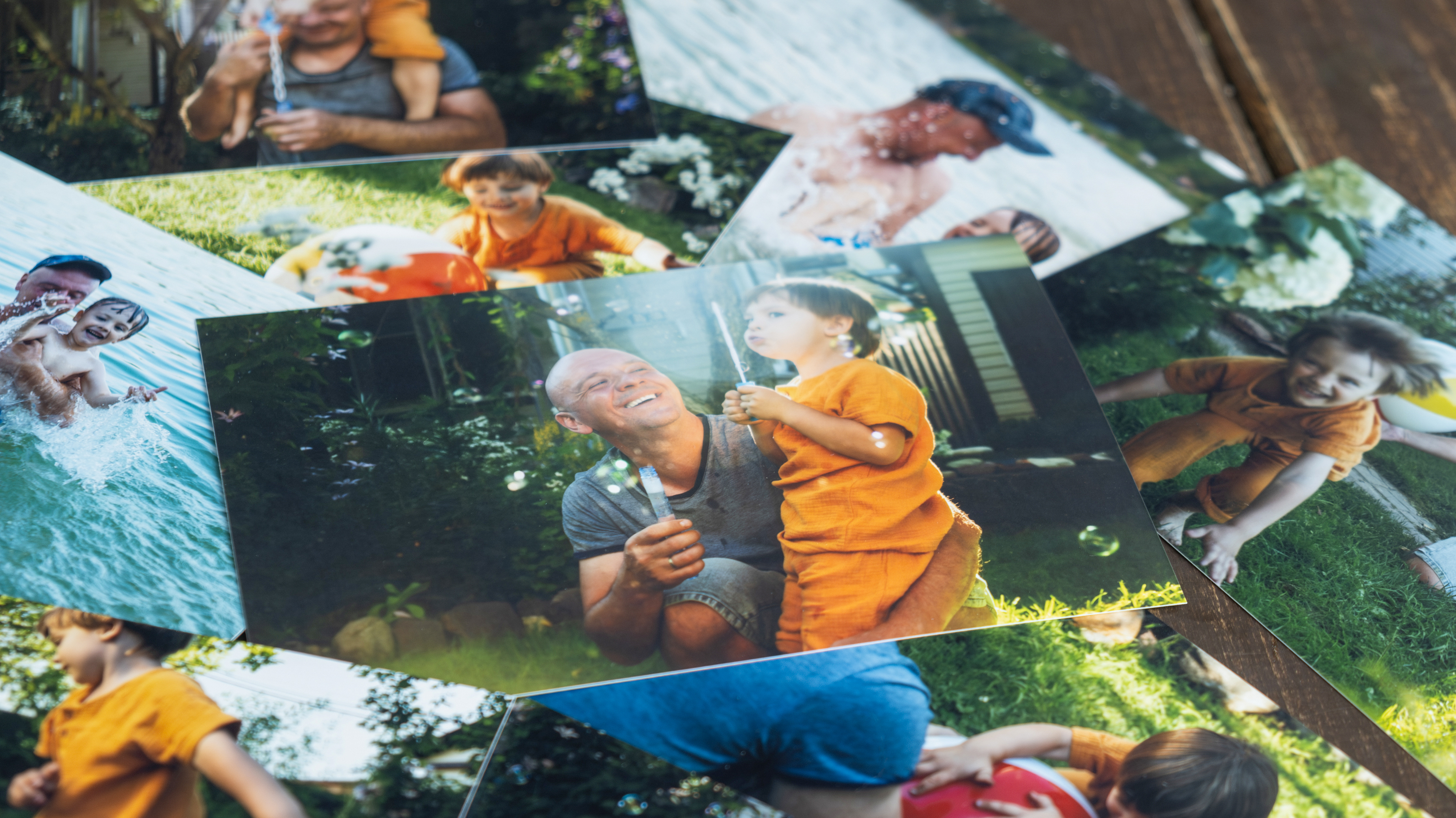 Printed family photos with happy summer moments.