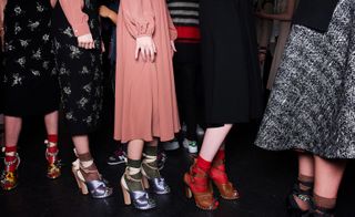 Footwear is this designer’s speciality — surprisingly, he hoisted his models up and off their preferred flat (but wacky) footwear and instead wrapped