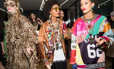 Models wear leopard-print dresses, silk bomber jackets and bright football jerseys