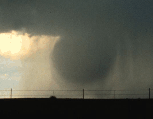 An animated image shows the core of a microburst slamming into the ground.