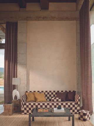 Checkerboard print sofa with matching stool